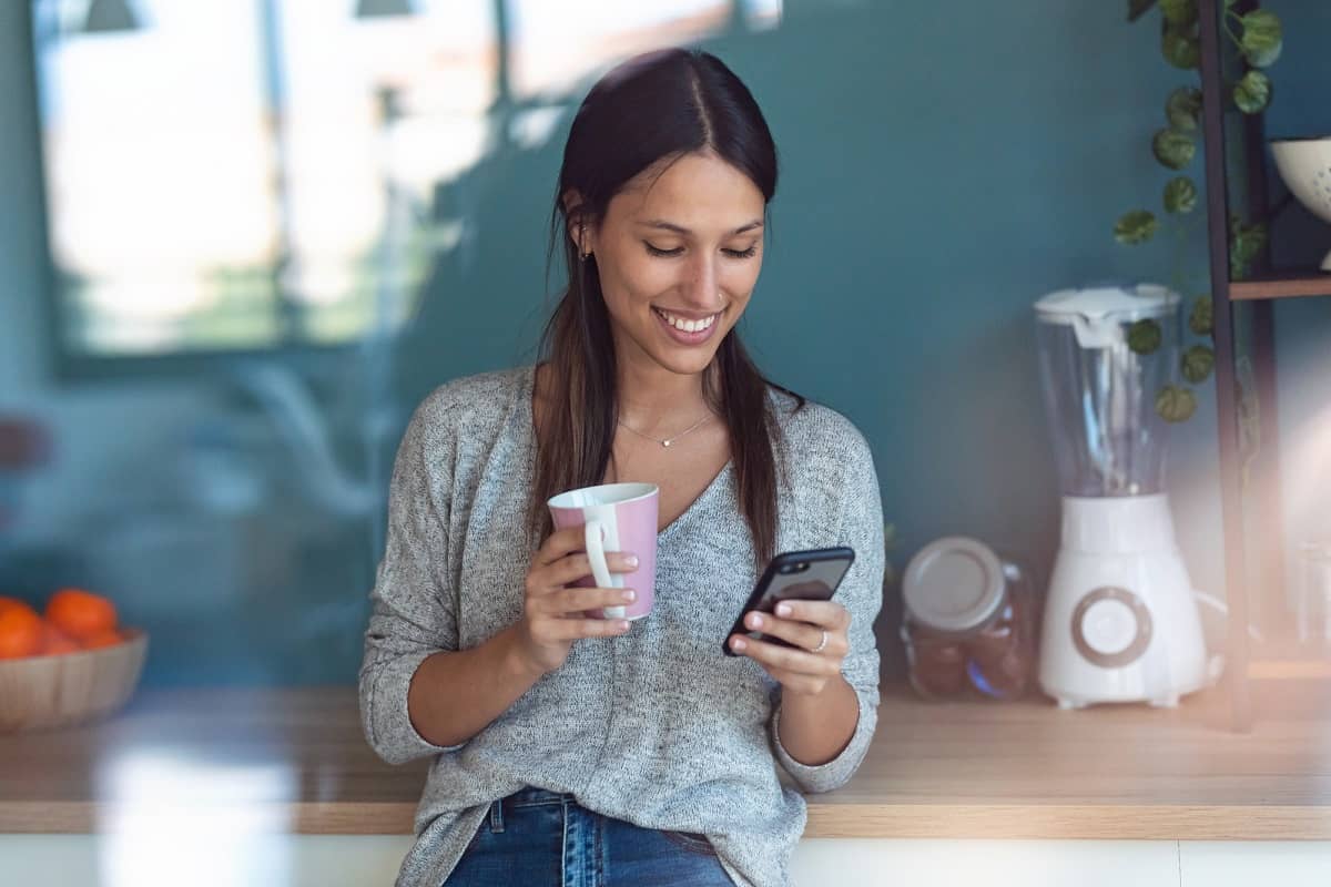 woman playing rummy for money on her smartphone